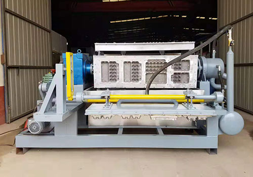 Machine de moulage de pâte et de fabrication de boîtes à œufs
